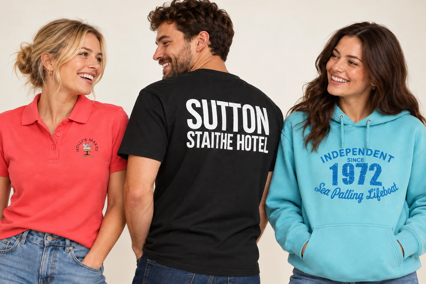 Models wearing Molly's Makes embroidered polo, Sutton Staithe Hotel printed T-shirt and Sea Palling Lifeboat printed hoodie